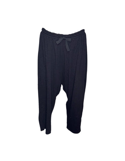 Black baggy pants on a white background